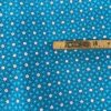 Tissu coton imprimé géométrique turquoise mètre