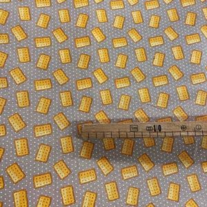 Tissu coton imprimé biscuit mètre