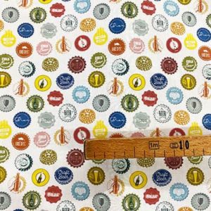 Tissu coton imprimé capsules bières mètre
