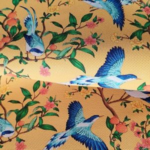 Tissu simili cuir oiseau orange pli