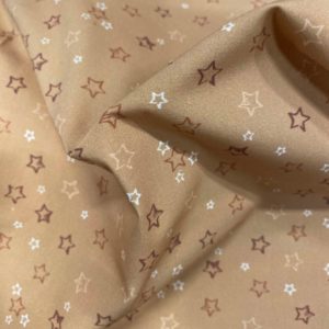 Tissu coton imprimé étoiles orange froissé